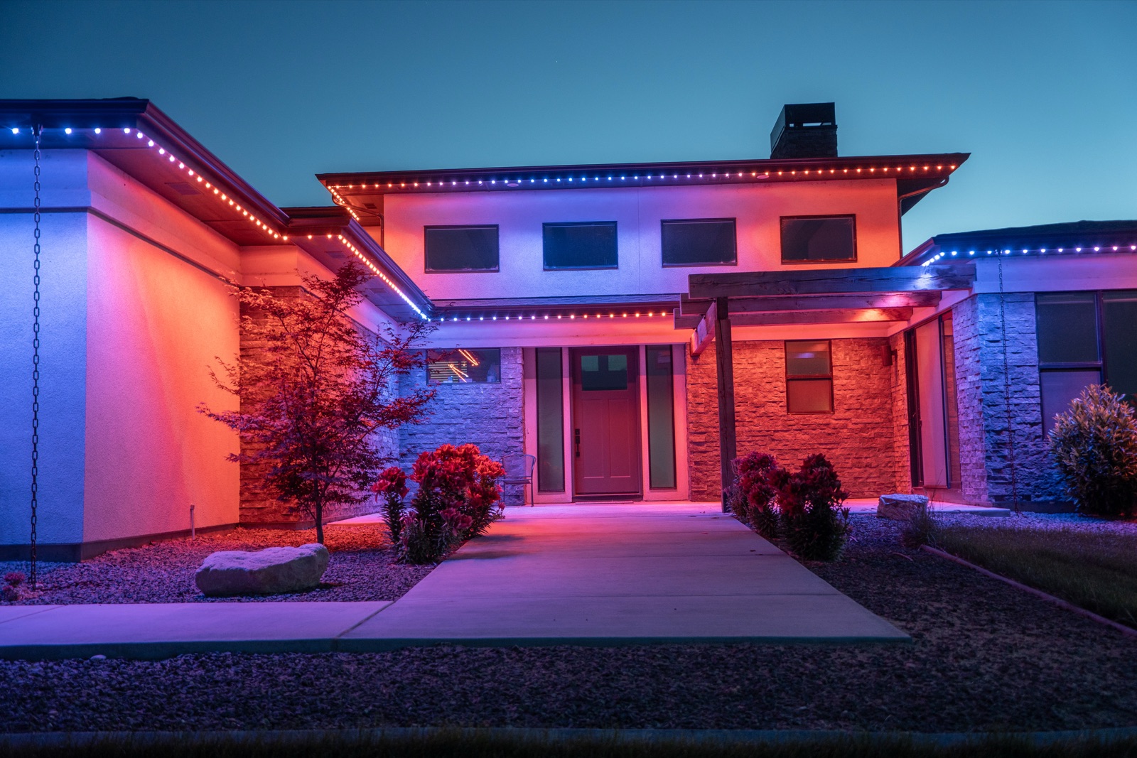 Modern home lit in custom team game day colors
